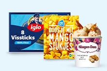 Verpakking Iglo vissticks, doosje AH mangostukjes en bekertje Häagen-Dazs macadamia ice cream bij elkaar.