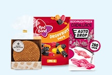 Stroopwafels, Red Band Dropfruit Duo's snoep en AutoDrop Cadillacs snoep in verpakkingen naast elkaar.