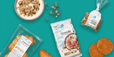 Verschillende Albert Heijn producten, waaronder croissants, glutenvrije granola en stroopwafels.