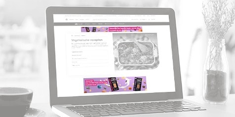 Website van Albert Heijn met vegetarische recepten en advertentie voor Etos Mijn Moment chocoladerepen.