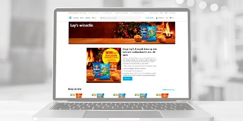 Winactie-pagina voor Lay's op een laptop, met kans op een Bol.com cadeaukaart ter waarde van €30.