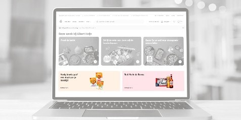 Website van Albert Heijn op een laptop met promoties voor deze week, inclusief honing bowls en Bud bier in de Bonus.