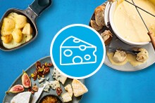 Kaaspfondue met stokbrood en kaasplank met diverse kazen en koude aardappels in een pan.