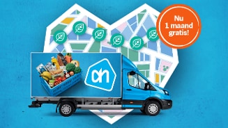 Albert Heijn bezorgbus met boodschappen en promotie voor één maand gratis bezorging, op de achtergrond een hartvormige plattegrond