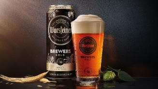 Bierblik en glas bier van Warsteiner Brewers Gold, met graankorrel en hop.