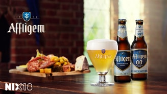 Affligem Belgisch witbier en charcuterie op een houten tafel met NIX18 logo.