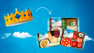 Verse maaltijdboxen van Albert Heijn met diverse ingrediënten en recepten, gepresenteerd op een blauwe achtergrond met een kroon als symbool voor topproducten.