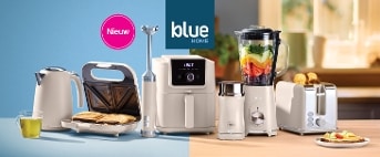 Keukenapparatuur van Klue Home met een broodrooster, blender, tosti-ijzer en waterkoker in een moderne keukeninstelling.