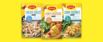 Drie Maggi sauzen: Creamy Cheese, Honey Mustard en Curry Coconut, verpakkingen op een gele achtergrond