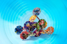 Een stapel kleurrijke schijfjes met bekende Disney- en Pixar-personages, waaronder Dory, Mickey Mouse, Winnie de Poeh en Assepoester.