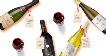 Assortiment van flessen wijn, waaronder Laurent Miquel Crémant de Loire brut, Fantini Farnese wijn, Vilarnau witte wijn en De Dàl Chardonnay, met wijnkaartjes en glazen rode wijn