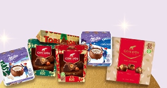 Assortiment van chocoladeproducten van Côte d'Or, Toblerone en Milka, inclusief Côte d'Or Pralines en Milka Oreo Snowballs.