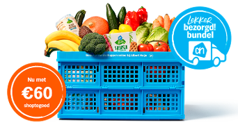 Blauwe Albert Heijn krat gevuld met diverse boodschappen zoals groenten, fruit en brood, met daarop een promotietekst over €60 shoptegoed en de 'Lekker bezorgd! bundel'.