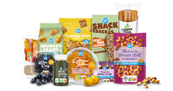 Lekkere en gezonde tussendoortjes zoals noten, snack crackers, crunchy beans, granola bites en druiven.