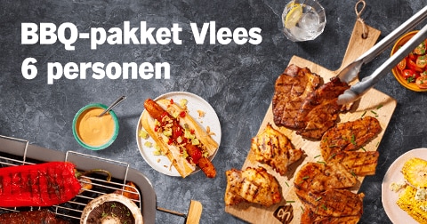 BBQ-pakket Vlees voor 6 personen met verschillende gegrilde stukken vlees en bijgerechten op een tafel.