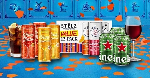 Verschillende blikjes alcoholische dranken van de merken Viva, STËLZ en Heineken, met daarnaast een glas cola met ijs en citroen en een glas rode wijn, op een blauwe ondergrond met oranje confetti.