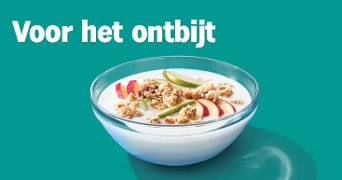 Kom ontbijten met een gezonde kom yoghurt met muesli en fruit.