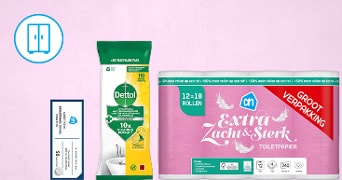 Dettol schoonmaakdoekjes, AH Extra Zacht & Sterk toiletpapier grootverpakking en een Albert Heijn voordeelbon tegen een roze achtergrond