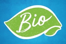 Groen blad met het woord 'Bio' op een blauwe achtergrond, symbool voor biologische producten.