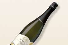 Fles Prosecco wijn met gouden etiket tegen een lichte achtergrond