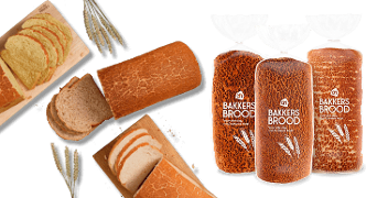 Brood van Albert Heijn Bakkerij, gesneden en in verpakkingen, met tigertijgerkorst en granen als decoratie.