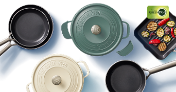 Diverse assortiment GreenPan pannen en Dutch Ovens, waaronder een braadpan, koekenpannen en een grillpan met gegrilde groenten.