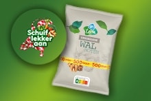 Verpakking van Djinn walnoten met een promotieband waarop staat "10 stuks, 500 gram". Links een groene cirkel met de tekst "Schuif lekker aan" en decoratieve snoepjes.