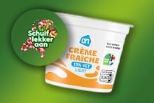 AH Crème fraîche 15% vet light verpakking op groene achtergrond met promotiebutton "Schuif lekker aan".