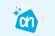 Albert Heijn logo met glinsterende sterren op een lichtblauwe achtergrond