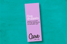 Verpakking van Care oogdruppels van Albert Heijn tegen droge en vermoeide ogen.