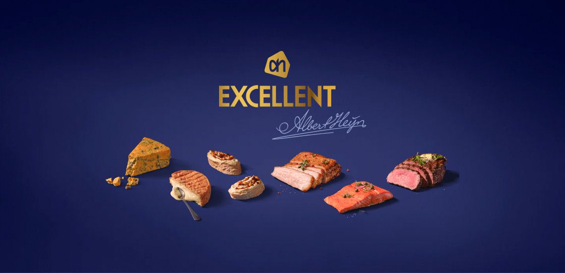 Verschillende luxe vlees-, vis- en kaasgerechten uit het Albert Heijn Excellent assortiment op een donkere achtergrond met het Excellent-logo.