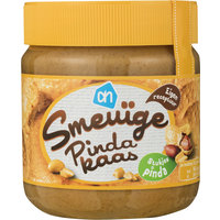 Een afbeelding van AH Smeuïge pindakaas met stukjes pinda