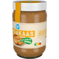 Een afbeelding van AH Pindakaas met stukjes pinda