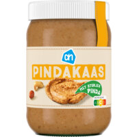 Een afbeelding van AH Pindakaas met stukjes pinda