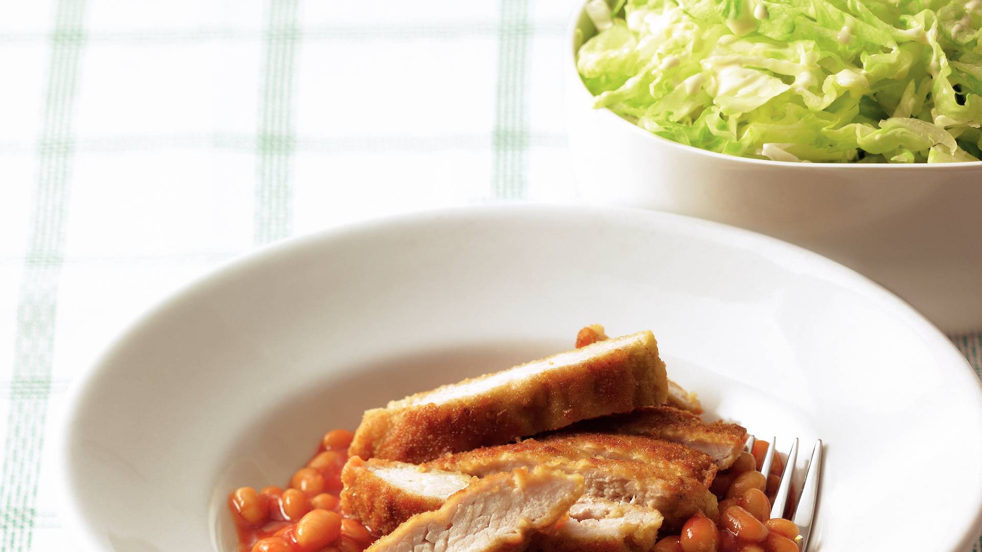 Schnitzel met witte bonen in tomatensaus recept Allerhande Albert Heijn België