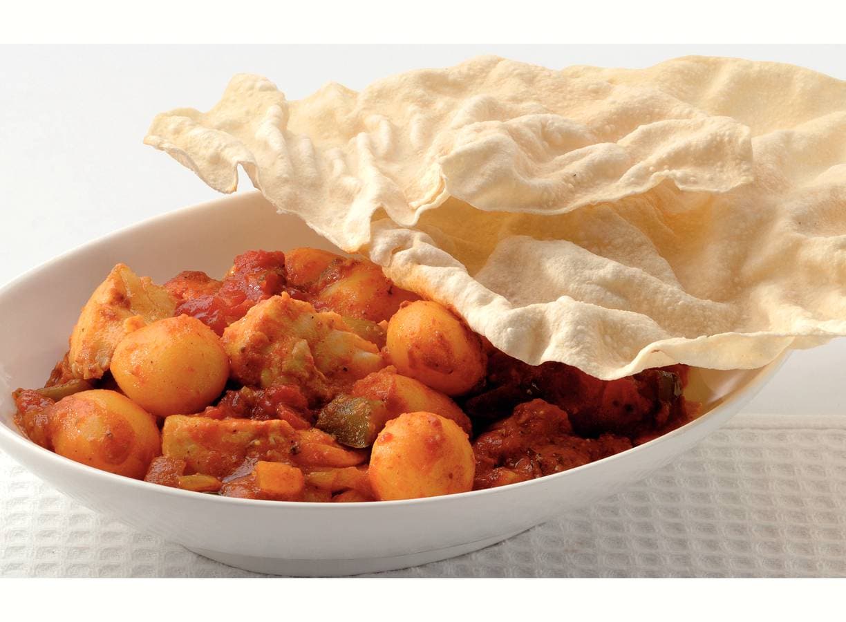 Korma-viscurry met pappadums