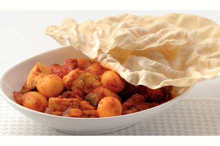 Korma-viscurry met pappadums