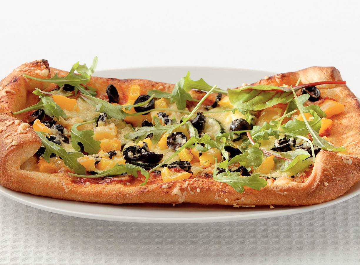 Pizza verdure met rucola