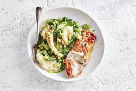 Schelvis in ham met aardappelpuree en spinazie