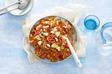 Couscous met kakifruit, geitenkaas en harissa