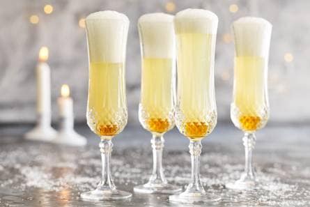 Cava met een scheutje perensap en honing