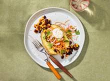 Gepofte aardappel met bonen in BBQ-saus